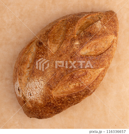 fresh homemade bread on parchment background, top view fresh homemade bread on parchment background, top view 116336657