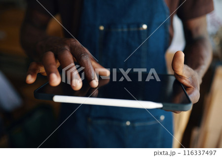 Man Working Online On Digital Tablet 116337497