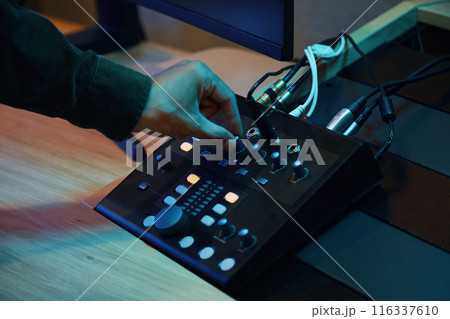 Musician Turning On The Sound On Control Panel Musician Turning On The Sound On Control Panel 116337610