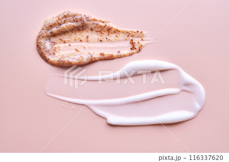 Cream and cream scrub on a pink background. Texture. Cream and cream scrub on a pink background. Texture. 116337620