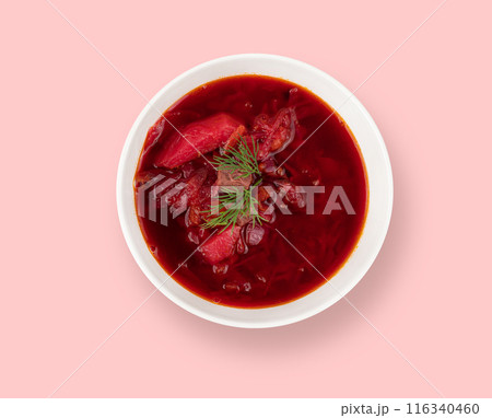 Borsch. Beetroot soup in a white plate on a pink background.  116340460