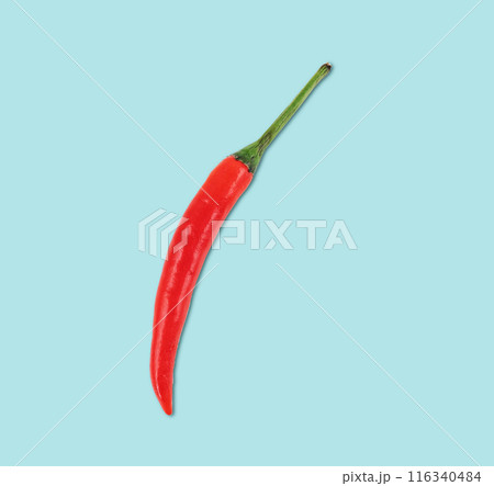 One red hot chili peppers on a blue background close-up. Top view and copy space One red hot chili peppers on a blue background close-up. Top view and copy space 116340484