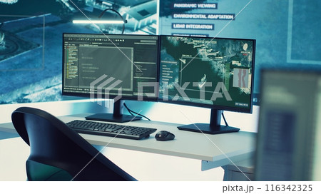 Government anti terrorism control center equipped with a big display and radar surveillance on satellite cctv system used for national reconnaissance. Empty military command space. 116342325