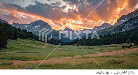 Swiss Alps snowy mountain range with valleys and meadows, countryside in Switzerland landscape. Golden hour majestic fiery sunset sky, travel destination wallpaper background 116344570