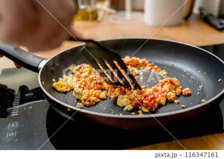 Chef at the kitchen preparing quesadillas with tofu and sweet corn 116347161