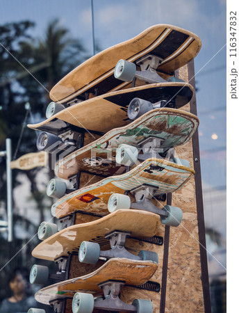 A stack of skateboards on a special outdoor stand 116347832