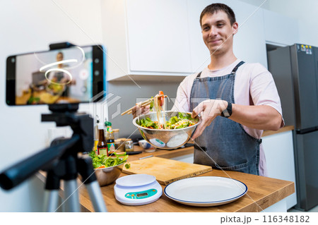The chef is broadcasting live from workshop how to prepare a spicy glass noodle salad 116348182