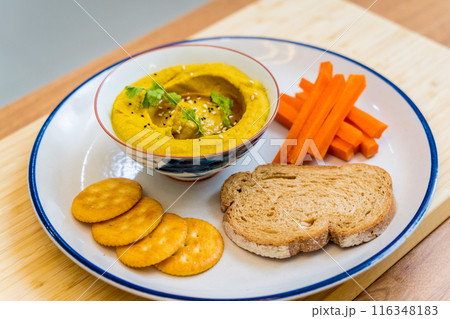 Nutritious and savory chickpea porridge with carrots Nutritious and savory chickpea porridge with carrots 116348183