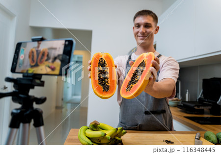 The chef is broadcasting live from workshop how to cuts and peels papaya The chef is broadcasting live from workshop how to cuts and peels papaya 116348445