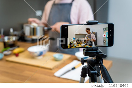 The chef is broadcasting live from workshop how to prepare a vegetarian food 116348463