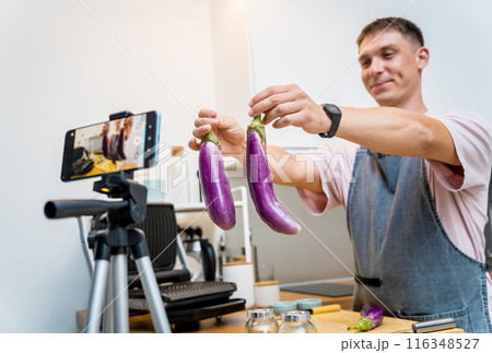 The chef is broadcasting live from workshop how to prepare a grilled eggplants with garlic The chef is broadcasting live from workshop how to prepare a grilled eggplants with garlic 116348527