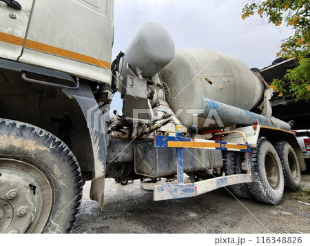 A concrete mixer truck parked beside of a concrete factory A concrete mixer truck parked beside of a concrete factory 116348826