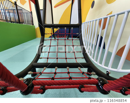 The trampoline features a mazepatterned surface for recreational use indoors 116348854