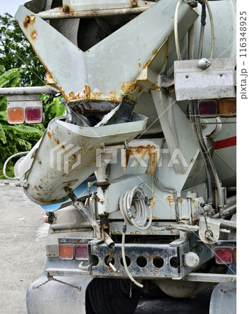 A concrete mixer truck parked beside of a concrete factory A concrete mixer truck parked beside of a concrete factory 116348925