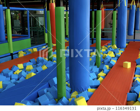 Trampoline park has blue and yellow foam cubes for kids fun Trampoline park has blue and yellow foam cubes for kids fun 116349131