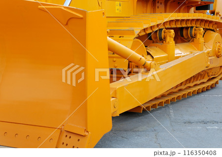 close-up side view of a tracked heavy bulldozer 116350408