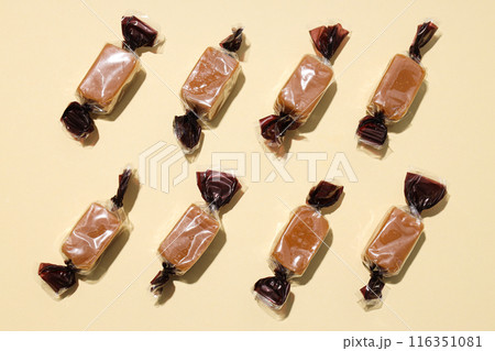 Salted caramel candies on a light background 116351081
