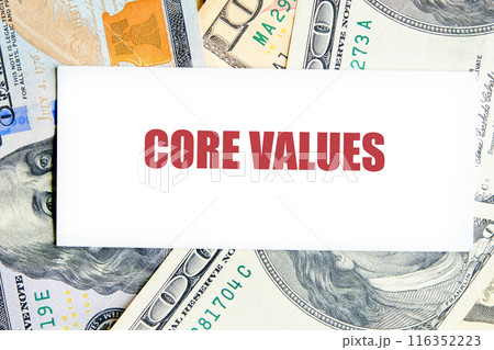 Business concept for presentations and reports. Text CORE VALUES on a business card against the background of dollar bills 116352223