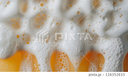 Close-up of beer foam and bubbles in a frothy glass Close-up of beer foam and bubbles in a frothy glass 116352633