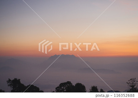 travel and people activity concept with twilight sky before sunrise with mountain and fog on foreground travel and people activity concept with twilight sky before sunrise with mountain and fog on foreground 116352688