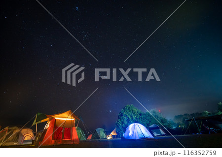 travel and people activity concept with star in the night with camping tent 116352759
