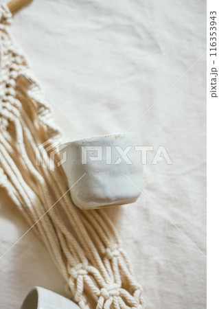 Ceramic cup on a textile Ceramic cup on a textile 116353943