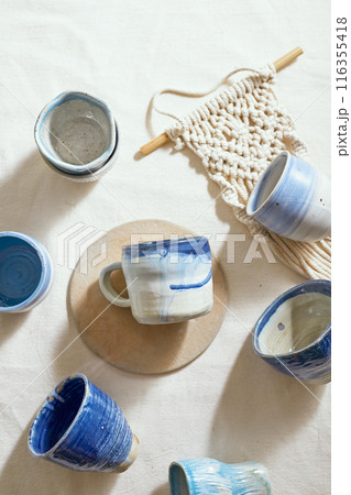 Ceramic cup on a textile Ceramic cup on a textile 116355418