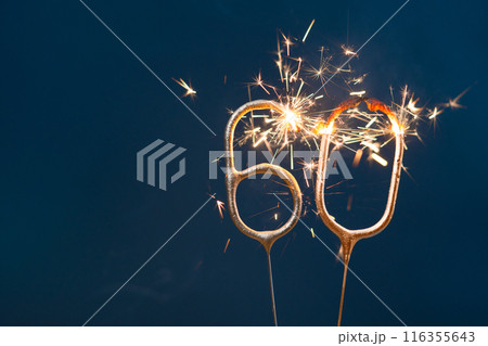 60 years celebration festive background made with Bengal fires in the form of number Sixty. 116355643