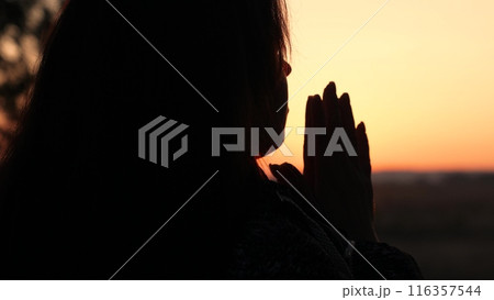 girl woman praying at sunset, hand sunset faith pain, asking heaven for help, girl sunset contemplation, silent prayer silhouette, sunset spiritual practice, evening devotion calm, girl meditating 116357544