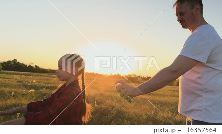 Father protect child with spray against mosquitoes, midges. Man dad spray on child kid daughter protect skin body from bites of mosquitoes, midges. Necessary measures for comfortable pastime in nature Father protect child with spray against mosquitoes, midges. Man dad spray on child kid daughter protect skin body from bites of mosquitoes, midges. Necessary measures for comfortable pastime in nature 116357564