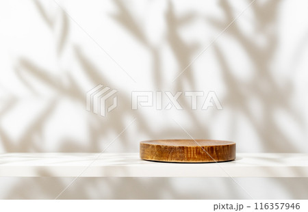 Cosmetic products presentation mockup scene made with empty wooden pedestal on white shelf. Elegant mediterranean style stage for your design. 116357946