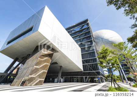 Building view of the Taipei Performing Arts Center in Taiwan. it's a modern building combining cube and sphere geometry. Building view of the Taipei Performing Arts Center in Taiwan. it's a modern building combining cube and sphere geometry. 116358214