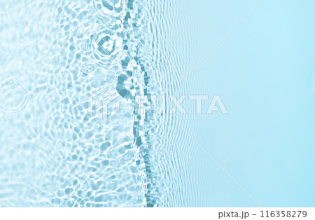 Blue water wave texture background with copy space. Featuring dynamic wave pattern and delicate splashe, the crystal-clear water is highlighted by the play of light and shadow. 116358279