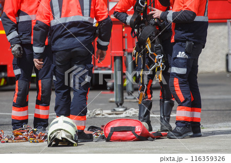 firefighters preparing for a rescue operation firefighters preparing for a rescue operation 116359326