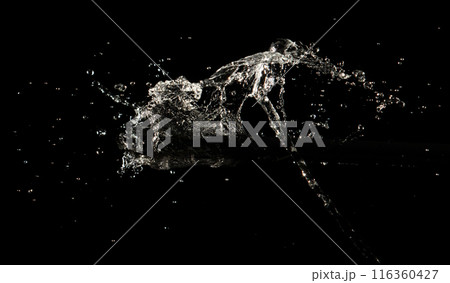 Crown water to object make curve drop explosion in ripple motion. Black background isolated. Crown Water splash on object to create shape form fluttering in droplet and wave. 116360427