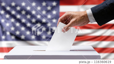 Hand Casting Ballot in USA Election, Close-Up View, American Flag Background, Symbol of Democracy, Citizen Participation, Federal Elections, Political Event, Voter Rights Hand Casting Ballot in USA Election, Close-Up View, American Flag Background, Symbol of Democracy, Citizen Participation, Federal Elections, Political Event, Voter Rights 116360619