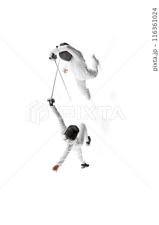 Poster. View from above of two female athletes, fencers work on their footwork and blade technique against white studio background. 116361024