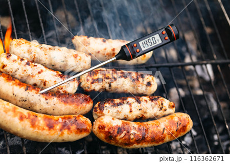 Grilled Sausages with Digital Thermometer Shows Danger Zone Temperature 116362671