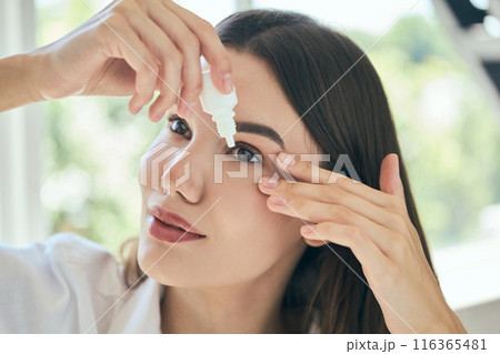 Eye Drops. Woman Applying Eye Drops for Fresh and Hydrated Eyes Eye Drops. Woman Applying Eye Drops for Fresh and Hydrated Eyes 116365481