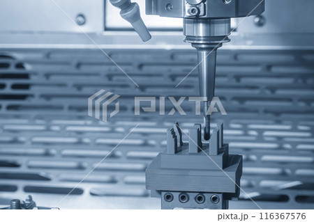 The CNC milling machine cutting the graphite electrode parts in the light blue scnen. The CNC milling machine cutting the graphite electrode parts in the light blue scnen. 116367576