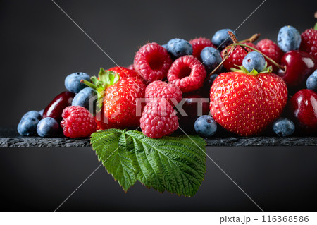Berries closeup colorful assorted mix. 116368586