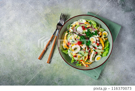 salad with squid, fresh cucumber, eggs, sweet pepper, red onion, with dressing, homemade, no people, salad with squid, fresh cucumber, eggs, sweet pepper, red onion, with dressing, homemade, no people, 116370073