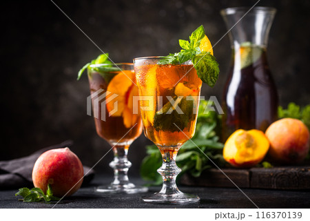 Cold ice tea with peach and mint 116370139