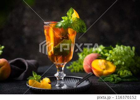 Cold ice tea with peach and mint Cold ice tea with peach and mint 116370152