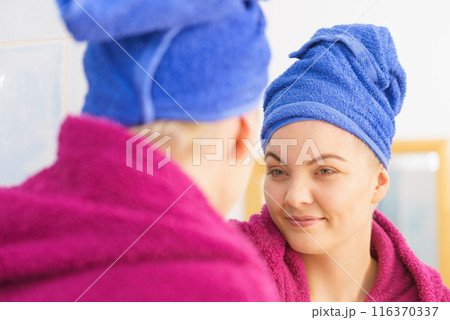Woman in towel after shower Woman in towel after shower 116370337