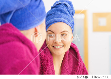 Woman in towel after shower Woman in towel after shower 116370344