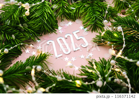 New Year 2025 pink background. Number of the coming year. 116371142