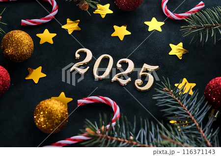 New Year 2025 background. Number of the coming year in Christmas decoration. New Year 2025 background. Number of the coming year in Christmas decoration. 116371143