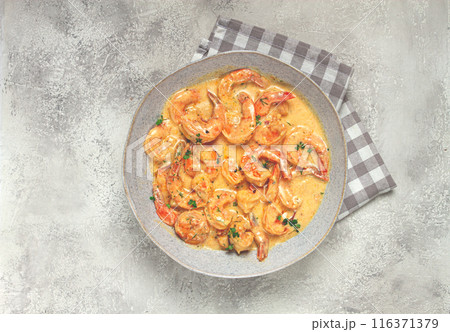 shrimp in creamy garlic sauce, with spices and herbs, 116371379