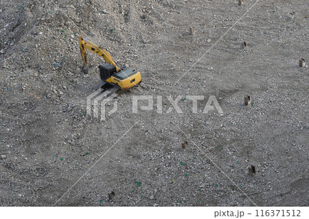 top view old black and yellow excavator is shoveling stones. construction area background, technology, onstruction, object, copy space 116371512